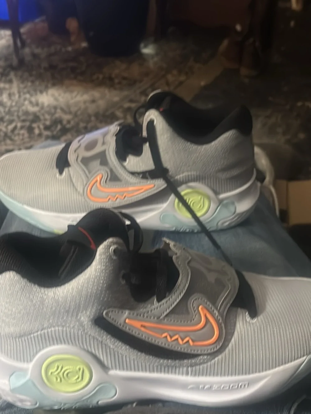 KDs Nike Grey Sneakers with Orange Swoosh and Black Accents
